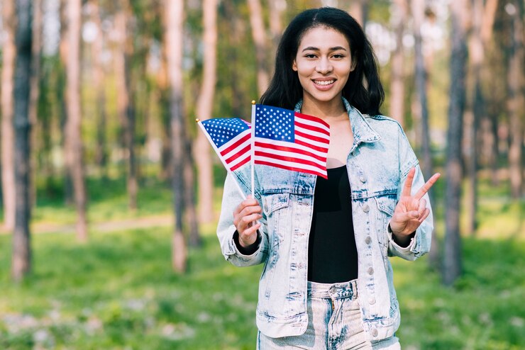 hispanic-woman-with-usa-flags-showing-peace-gesture_23-2148167008